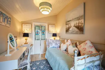 a living room with a couch and a table at Host & Stay - The Cheeky Squirrel in New Brighton