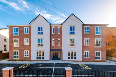 an image of an apartment building at Modern 2BR Flat with Parking, Fully Equipped, Sleeps 4 in Liverpool