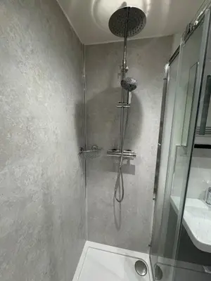 a bathroom with a shower with a glass door at Cosy Modern 2 Beds Chorley Center in Chorley