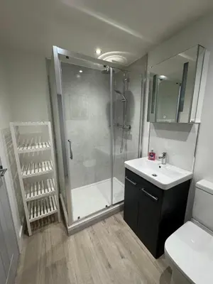 a bathroom with a shower and a sink at Cosy Modern 2 Beds Chorley Center in Chorley