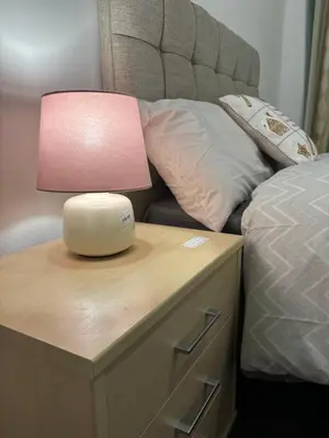 a pink lamp on a nightstand next to a bed at Platt Bridge Contractor Stays-2 bedroom house in Abram
