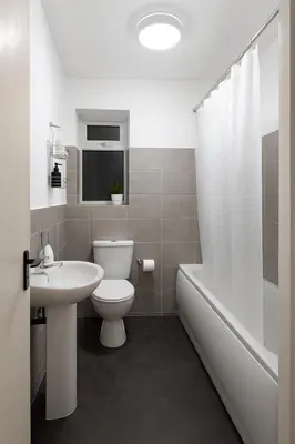 a bathroom with a toilet and a sink and a tub at Platt Bridge Contractor Stays-2 bedroom house in Abram