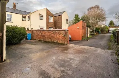 an empty driveway in front of a house at Ribby Stays - 2 bed Cottage Pet Friendly in Wrea Green