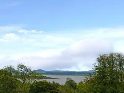 a view of a body of water with trees at Priory View in Ulverston