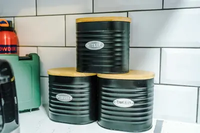 three black barrels stacked on top of each other at Long Stays Offers , New 2 Bed APT , Sleeps 3 , Wigan , Perfect for Relocations , Contractors , Families in Ince-in-Makerfield