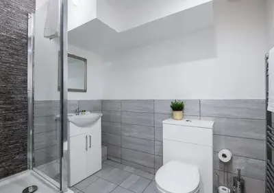 a bathroom with a toilet and a sink and a shower at The Bloc - Liverpool Nightlife Apartments in Liverpool