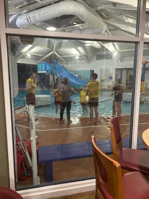 a group of people standing in a swimming pool at Haven Cala gran in 2026 through to Jan 2027 spring summer winter breaks Blackpool Fleetwood entire home 6 people seaside holiday park in Fleetwood