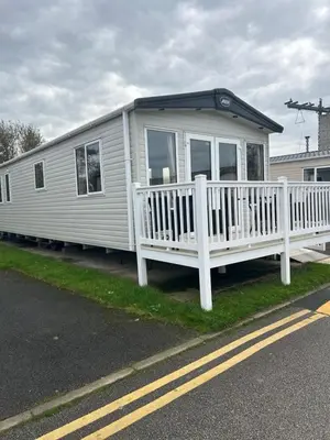 a mobile home with a porch and a white railing at Haven Cala gran in 2026 through to Jan 2027 spring summer winter breaks Blackpool Fleetwood entire home 6 people seaside holiday park in Fleetwood