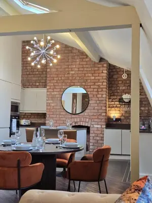 a dining room with a table and chairs at City Centre Luxury Apartment in Liverpool