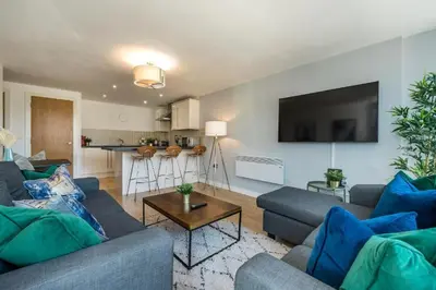 a living room with two couches and a table at Central 2 Bed Apt with Balcony in Liverpool