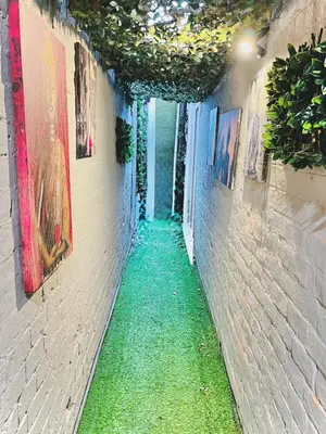 a narrow alley with a green floor in a building at Ideal pay-as-you-stay 1-bed apartment in Preston in Preston