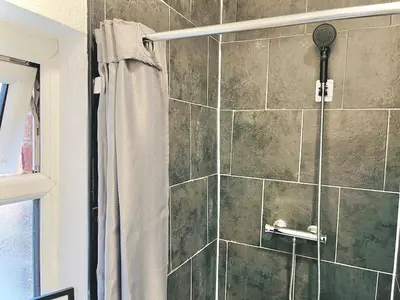 a shower with a shower curtain in a bathroom at Ideal pay-as-you-stay 1-bed apartment in Preston in Preston