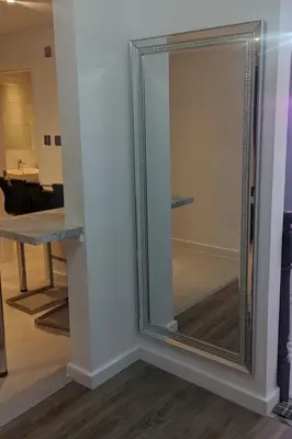 a mirror with a silver frame on a wall at Dream101, Luxury 2 Bedroom apartment - free parking in Liverpool