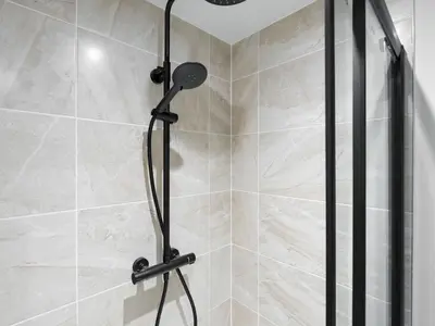 a shower with a shower head in a bathroom at Pass the Keys Luxury Flat with River Views. 1 Bed. Sleeps 4 in Liverpool