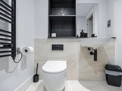a bathroom with a white toilet and a sink at Pass the Keys Luxury Flat with River Views. 1 Bed. Sleeps 4 in Liverpool
