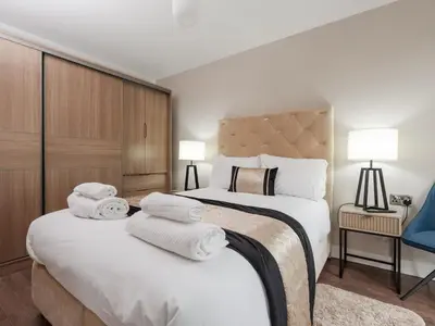 a hotel room with two beds with towels on them at Pass the Keys Luxury Flat with River Views. 1 Bed. Sleeps 4 in Liverpool