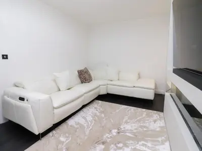 a white couch sitting in a living room at Mellings Place in Carnforth