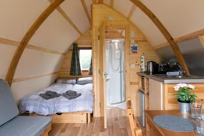 a bedroom with a bed in a tiny house at Kidsnape Farm by Wigwam Holidays in Goosnargh