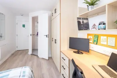 a bedroom with a desk with a computer on it at For Students Only Myrtle Court in Liverpool in Liverpool
