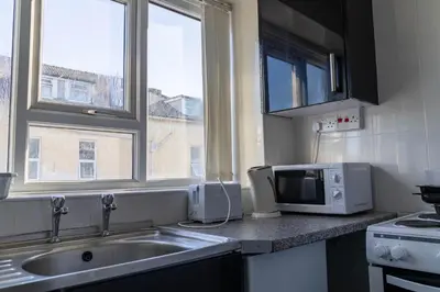 a kitchen with a sink and a microwave at One Bedroom Apartment by Brookland Stays Serviced Accommodation Short Lets Blackpool with Free WiFi in Blackpool