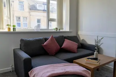 a living room with a couch and a table at One Bedroom Apartment by Brookland Stays Serviced Accommodation Short Lets Blackpool with Free WiFi in Blackpool