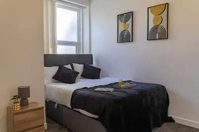 a bedroom with a bed with a tray on it at One Bedroom Apartment by Brookland Stays Serviced Accommodation Short Lets Blackpool with Free WiFi in Blackpool