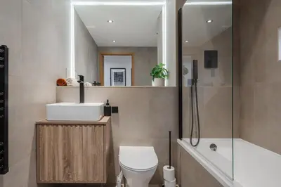 a bathroom with a toilet and a sink and a shower at Stunning Central 2 bed Apt, 2 Baths in Liverpool
