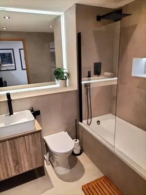 a bathroom with a toilet and a sink and a shower at Stunning Central 2 bed Apt, 2 Baths in Liverpool