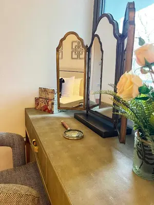 a dresser with a mirror on top of it at Central, Stylish 2BR Flat Sleeps 6 with Parking! in Liverpool