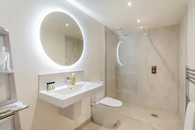 a white bathroom with a sink and a shower at 2 Bed in Dunsop Bridge oc-w33524 in Newton