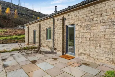 a brick building with a table and a patio at 2 Bed in Dunsop Bridge oc-w33524 in Newton