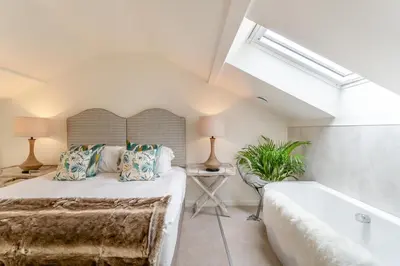 a bedroom with a large bed and a bathtub at 2 Bed in Dunsop Bridge oc-w33524 in Newton