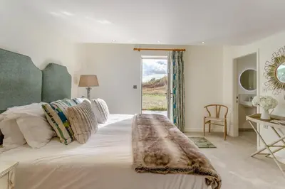 a bedroom with a bed and a desk and a window at 2 Bed in Dunsop Bridge oc-w33525 in Newton