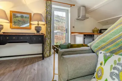 a living room with a couch and a window at 2 Bed in Dunsop Bridge oc-w33525 in Newton