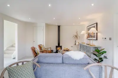 a living room with a blue couch and a table at 2 Bed in Dunsop Bridge oc-w33526 in Newton