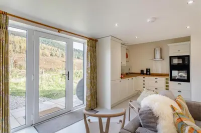 a living room with a couch and a kitchen at 2 Bed in Dunsop Bridge oc-w33526 in Newton