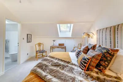 a bedroom with a large bed and a bathroom at 2 Bed in Dunsop Bridge oc-w33526 in Newton