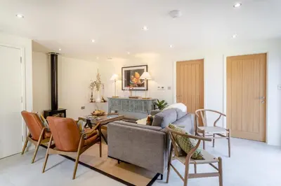 a living room with a couch and chairs at 2 Bed in Dunsop Bridge oc-w33526 in Newton