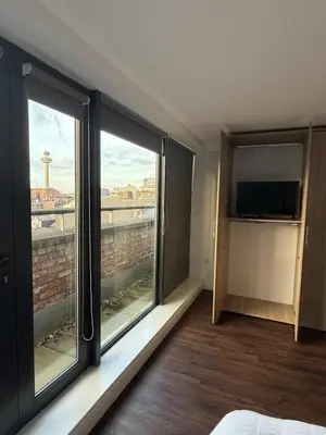 a room with a large window with a view at Liverpool City Centre - Skyline Apartment in Liverpool