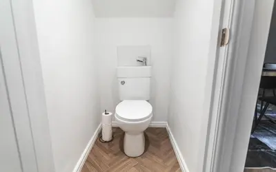 a bathroom with a white toilet in a room at 5 Bed Stay For Contractors And Families in Morecambe