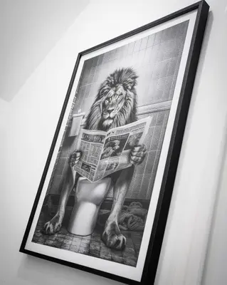 a picture of a lion reading a newspaper in a bathroom at Comfortable 3-bedroom Bolton home in Westhoughton