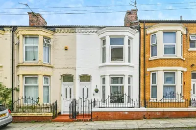 a row of brick houses in a city at 4 bed house Liverpool L7 in Liverpool
