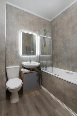 a bathroom with a toilet and a sink and a tub at Harrington Chambers by Charming Apartments - Pool Table & Ping Pong in Liverpool