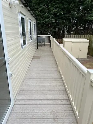 a porch with a bench on the side of a house at 2025 Willerby Ellerton Static Caravan in Morecambe