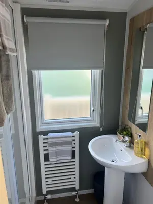 a bathroom with a sink and a window at 2025 Willerby Ellerton Static Caravan in Morecambe