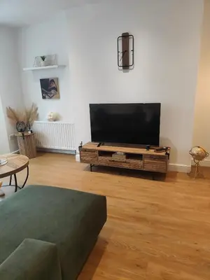 a living room with a large flat screen tv at luxury Maisonette near beach in Morecambe