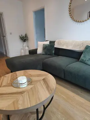 a living room with a couch and a coffee table at luxury Maisonette near beach in Morecambe