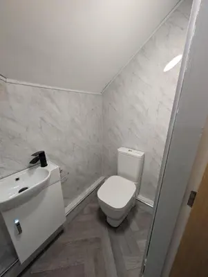 a bathroom with a white toilet and a sink at Park Lodge Preston in Preston