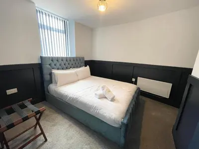 a bedroom with a bed in a room at Serenity Wembley in Blackpool