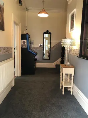 a room with a mirror and a slide at West Vale Villa in Blackpool